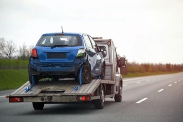 Vehicle transport on a tow truck